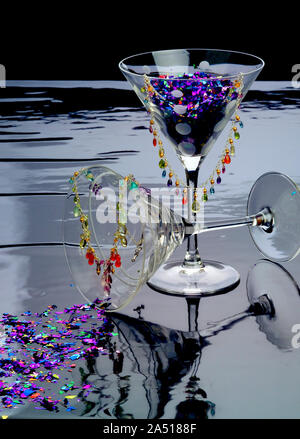 Es ist Party Time. Zwei Gläser Gläser mit Konfetti und eine Festlegung gefüllt. Konfetti Steinketten drapiert von der Brille. Hochglanz schwarz Gewellt Stockfoto