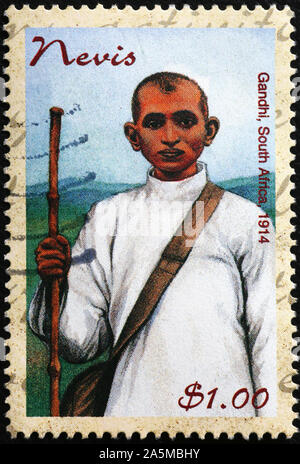 Junge Gandhi auf Briefmarke von Nevis Stockfoto