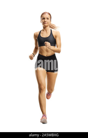 In voller Länge Porträt einer weiblichen Athleten im laufenden Outfit joggen auf die Kamera auf weißem Hintergrund Stockfoto