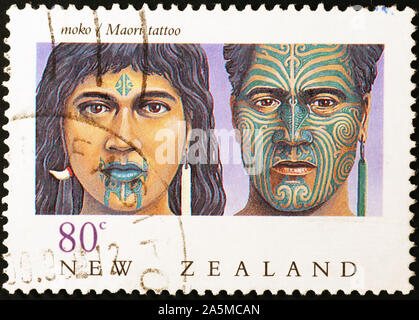 Facial tattoos Maori auf Neuseeland Briefmarke Stockfoto