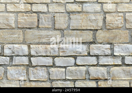 Nahtlose Textur. Fragment einer Wand aus Kalkstein Steinblöcke für den Einsatz als nahtlose Hintergrund und Textur. Stockfoto