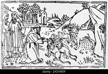 der Heilige Hieronymus mit einem Löwen, in Anlehnung an die hagiographischen Volksglaube, dass Jerome einen Löwen in der Wildnis gezähmt hatte, durch die Heilung seiner Pfote dargestellt. Holzschnitt 1497 Stockfoto