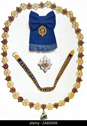 Reihenfolge der das Strumpfband und andere Krönung Aufträge Insignien getragen von König George VI bei seiner Krönung Ans britische König im Jahr 1937 Stockfoto