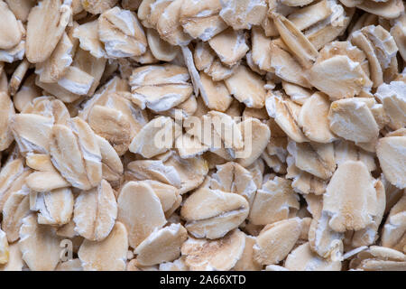 Golden Müsli Müsli, Hintergrund und Textur. Haferflocken Körner, Nahaufnahme, Ansicht von oben, Makro. Gesundes Frühstück Stockfoto