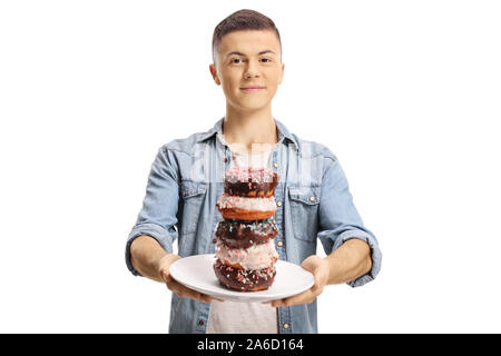 Teenage boy Holding eine Platte der Donuts auf weißem Hintergrund Stockfoto