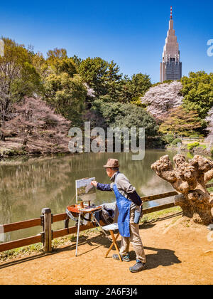 4. April 2019: Tokyo, Japan - Künstler Malerei Kirschblüte und der See sind in Shinjuku Gyoen National Garten, Tokio. Stockfoto