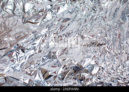 Abstrakte zerknittert silberne Aluminiumfolie closeup Hintergrund Stockfoto