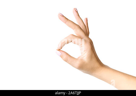 Schöne weibliche Hand gestikulierend. Okay Symbol. Auf weissem Hintergrund. Stockfoto