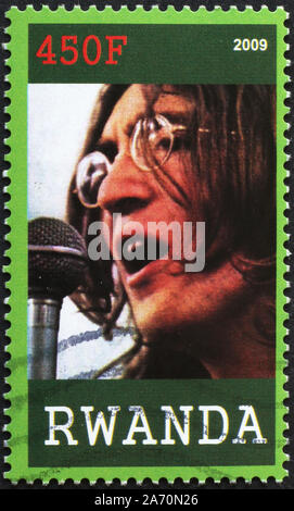 John Lennon auf Briefmarke von Ruanda Stockfoto