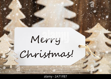 Weihnachtsbaum, Label mit englischem Text frohe Weihnachten, Schneeflocken Stockfoto