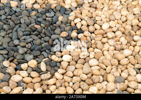 Zwei Ton Farbe Felsen. stein Wand Textur Foto, Stein Hintergrund. Zwei Ton Stein im Garten. Zwei Ton stein Wand Textur. Steine in den Park. Stockfoto