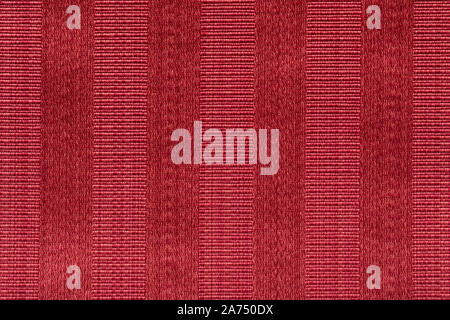 Fabric gestreiften Hintergrund. Red Faserstruktur polyester Close-up. Ein feines Korn roter Stoff fühlte. Stockfoto