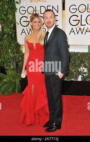 LOS ANGELES, Ca - 12. JANUAR 2014: Aaron Paul & Lauren Parsekian am 71st jährlichen Golden Globe Awards im Beverly Hilton Hotel. © 2014 Paul Smith/Featureflash Stockfoto