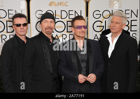 LOS ANGELES, Ca - 12. JANUAR 2014: U2 mit Bono & Edge auf der 71st jährlichen Golden Globe Awards im Beverly Hilton Hotel. © 2014 Paul Smith/Featureflash Stockfoto