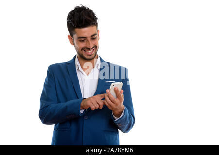 Die Jungen gut aussehenden bärtigen Persischen Geschäftsmann in Phone Anzug Stockfoto