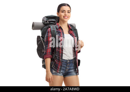 Junge weibliche Wanderer mit Rucksack lächelnd in die Kamera auf weißem Hintergrund Stockfoto