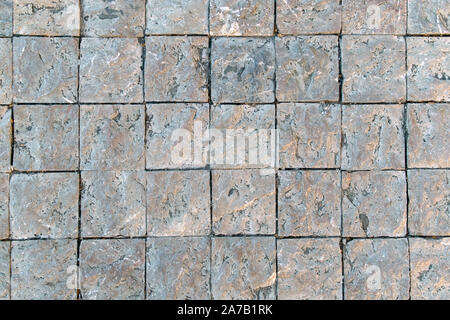 Granit gepflasterten Gehsteig Hintergrund. Fragment einer Gehsteig entlang einer Straße in Griechenland. Stockfoto