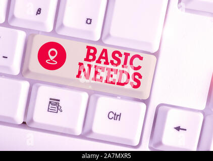 Konzeptionelle Handschrift, die grundlegenden Bedürfnisse. Begriff Sinne etwas, dass Sie haben müssen, um zu leben weiß PC-Tastatur mit Hinweis live oder Stockfoto