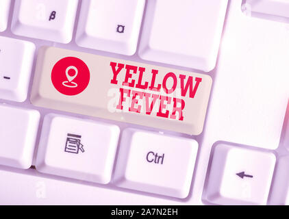 Konzeptionelle Hand schreiben, Gelbfieber. Begriff Sinne tropischen Virus Erkrankung, die Leber und die Nieren Weiß pc-Tastatur mit Papier Stockfoto