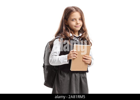 Süßes schulmädchen Holding ein Notebook auf weißem Hintergrund Stockfoto