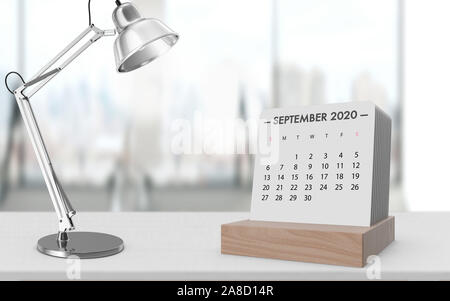 September 2020 Kalender auf eine weiße Holztisch mit Schreibtisch Lampe vor der glänzenden modernen Büro Hintergrund. 3D-Rendering. Stockfoto