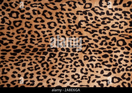 Kunstfell leopard Textur Hintergrund. Modernen ökologischen Material. Plaid oder Teppich. Stockfoto