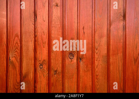 Hintergrund der Holzbretter lackiert mit roten marilka. Stockfoto