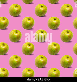 Nahtlose Muster mit grünen Äpfeln auf einem rosa Hintergrund Stockfoto