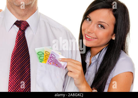 Junge Frau, 25, 30, Jahre, zieht einem Mann Euro Geldscheine aus der Tasche, HERR: Ja, Stockfoto