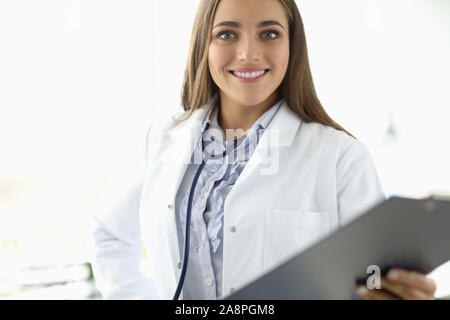 Cute woman in White Coat Stockfoto