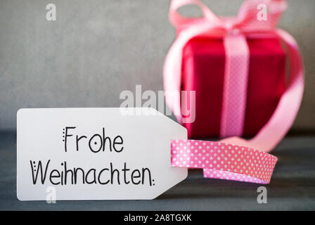 Rosa Weihnachten Geschenk, Kalligraphie Frohe Weihnachten bedeutet Frohe Weihnachten Stockfoto