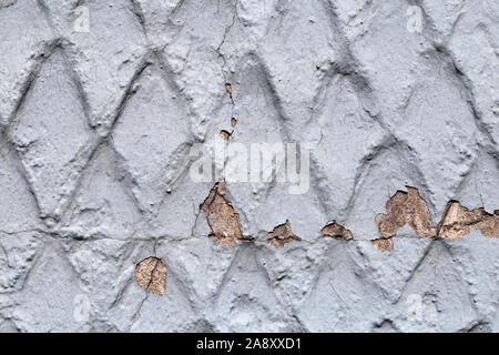 Closeup Details einer äußeren Gebäudewand. Diese Mauer ist aus Stein und Beton und mit grauen Farbe lackiert. Die Wand hat schöne Geometrie! Stockfoto
