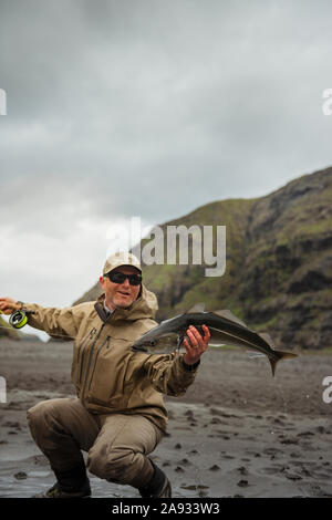 Mann mit Fisch Stockfoto