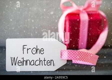 Rosa Weihnachten Geschenk, Kalligraphie Frohe Weihnachten bedeutet, frohe Weihnachten, Schneeflocken Stockfoto