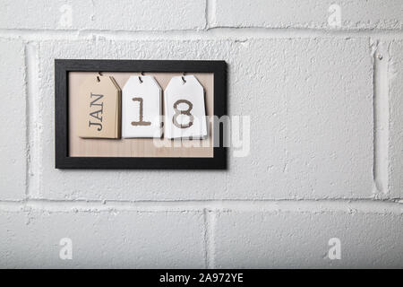 An der Wand hängenden Kalender in einem Bilderrahmen angezeigt. Januar 18. Stockfoto
