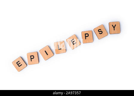 Das Wort Epilepsie, Dinkel mit hölzernen Buchstabensteine über einem weißen Hintergrund. Stockfoto