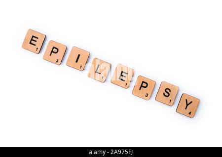 London, Großbritannien - 8. Juli 2019: Das Wort Epilepsie, Dinkel mit hölzernen Buchstabensteine über einem weißen Hintergrund. Stockfoto