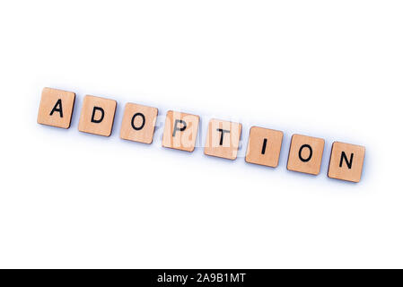 Das Wort "Annahme, Dinkel, mit hölzernen Buchstabensteine. Stockfoto