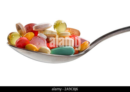 Viele Medikamente, Vitamine und Nahrungsergänzungsmittel auf Löffel. Die pharmazeutische Medizin Pillen, Tabletten und Kapseln auf Holzlöffel. Einschließlich Vitamin C, v Stockfoto