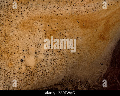 Kaffee Schaum extreme Close up. Makro Textur und Hintergrund Stockfoto