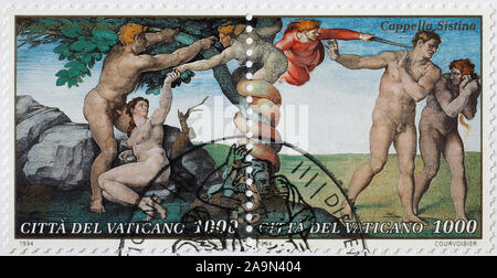 Die ursprüngliche Sünde und Vertreibung aus Eden von Michelangelo auf Briefmarke Stockfoto