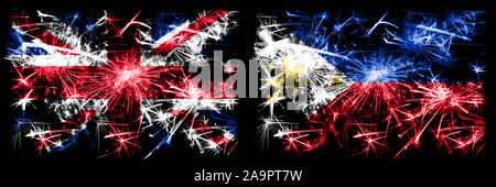 Großbritannien, United Kingdom vs Philippinen, Philippinen neues Jahr Feier reisen funkelnden Feuerwerk flags Konzept Hintergrund. Kombination von zwei ab Stockfoto