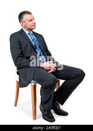 Ein Sitzung gut aussehend Geschäftsmann sucht Stockfoto