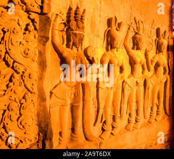 Wand Schnitzereien bei Sonnenuntergang, Bayon Tempel, Angkor Watt Archäologischen Park, Kambodscha, Stadt Angkor Thom, erbaut 1100-1200, Khymer Kultur rins Stockfoto