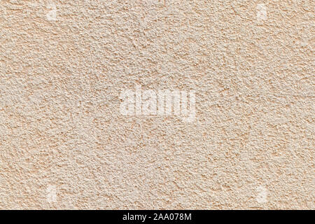 Fragment einer beige Verputzte Wand mit feiner Textur. Für den Einsatz als abstrakter Hintergrund. Stockfoto