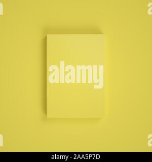 Leere gelbe Buch auf gelben Hintergrund. Easy Cover mockup. Vorderansicht. Stockfoto