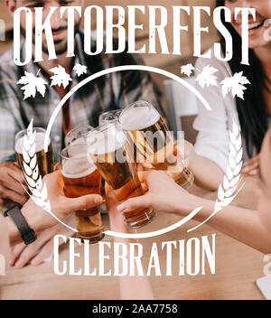 Teilweise mit Blick auf die multikulturelle Freunde klirren Gläser Bier im Pub mit Oktoberfest Abbildung Stockfoto