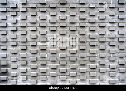 Originale design Lösungen in moderner urbaner Architektur. Wand eines Gebäudes aus Pflastersteine. Stockfoto