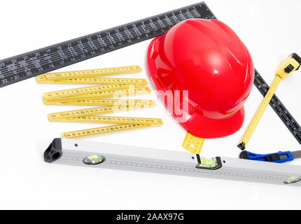 Foto der Helm und Tools für Konstruktionszeichnungen und Gebäuden Stockfoto