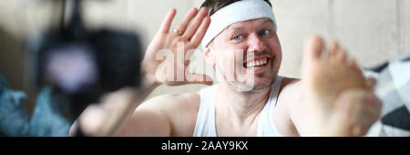 Lächeln Sportler der Trainingsaufzeichnung für Sport Blog Stockfoto